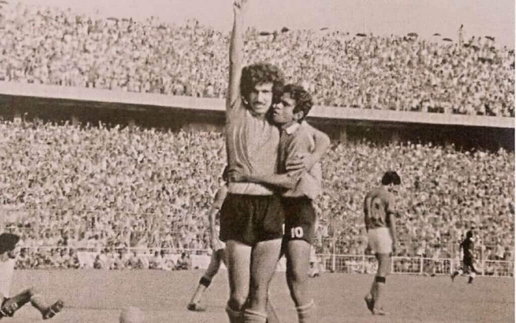 Mohammed Habib hugs Jamshed Nassiri at a packed Eden Gardens.