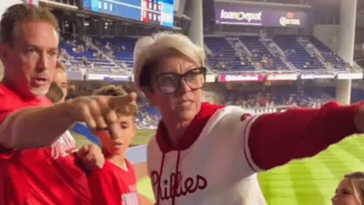 Image of Phillies Karen who left the game with a baseball originally caught by a child.